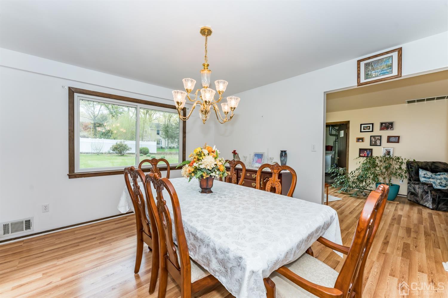 88 Stratton Street South Piscataway, NJ 08854 - Photo 5 of 22 a view of a dining room with furniture a chandelier and wooden floor