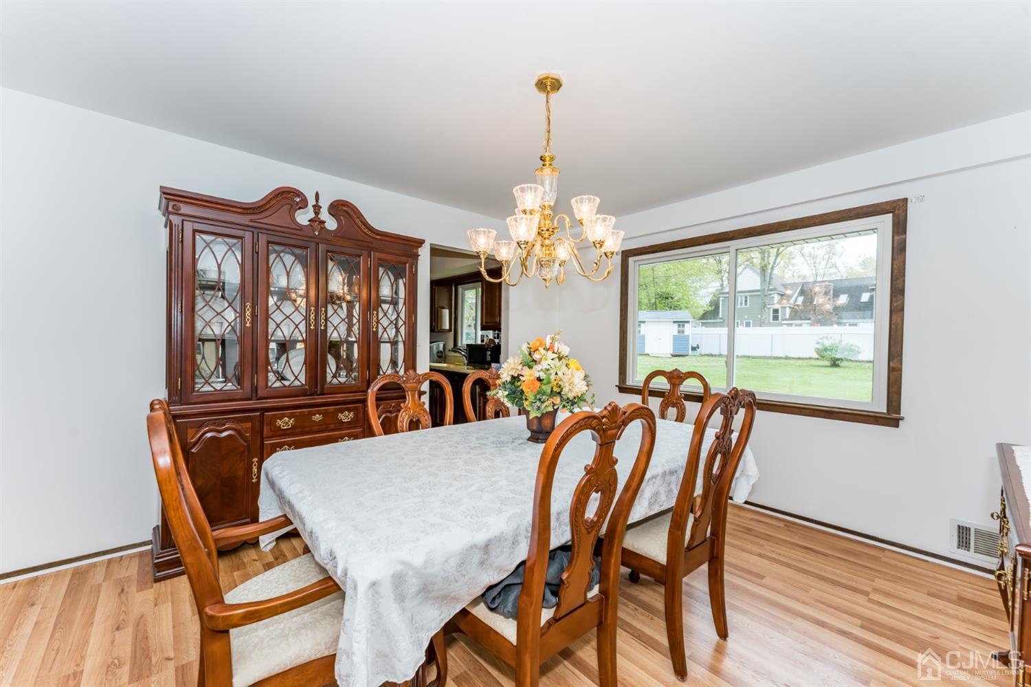 88 Stratton Street South Piscataway, NJ 08854 - Photo 6 of 22 a view of a dining room with furniture a chandelier and wooden floor