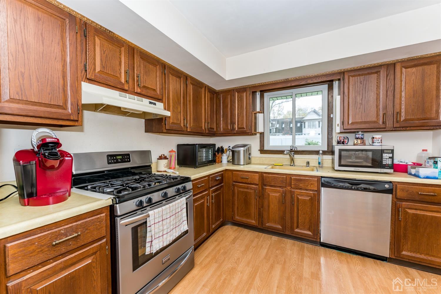 88 Stratton Street South Piscataway, NJ 08854 - Photo 8 of 22 a kitchen with stainless steel appliances granite countertop a stove sink and cabinets