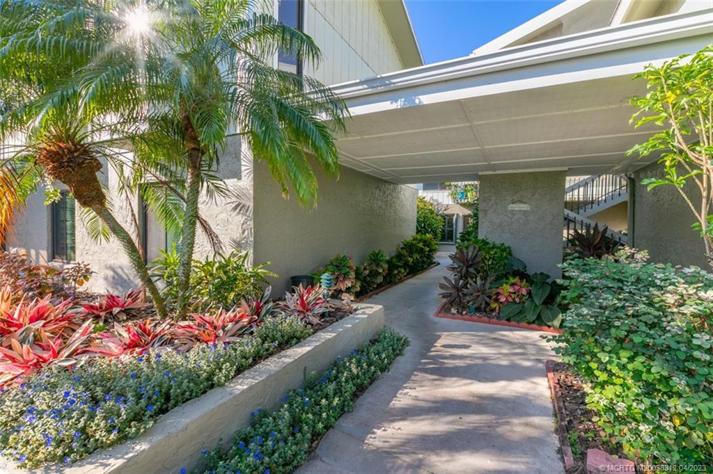 800 Northwest Fork Road, Unit 86 Stuart, FL 34994 - Photo 2 of 40 a view of a flower in a garden