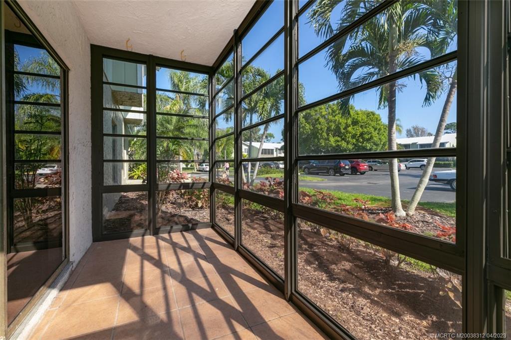800 Northwest Fork Road, Unit 86 Stuart, FL 34994 - Photo 22 of 40 a view of a glass door with a balcony