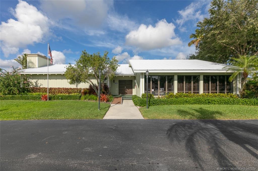 800 Northwest Fork Road, Unit 86 Stuart, FL 34994 - Photo 25 of 40 a front view of house with yard and green space