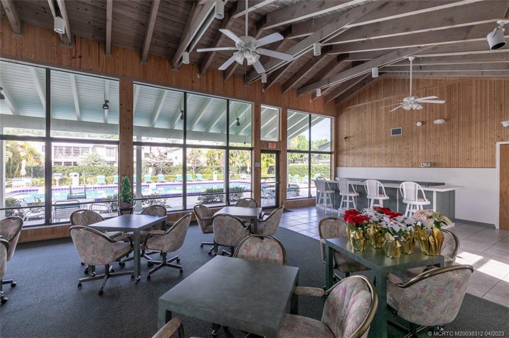 800 Northwest Fork Road, Unit 86 Stuart, FL 34994 - Photo 30 of 40 a living room with furniture and a large window