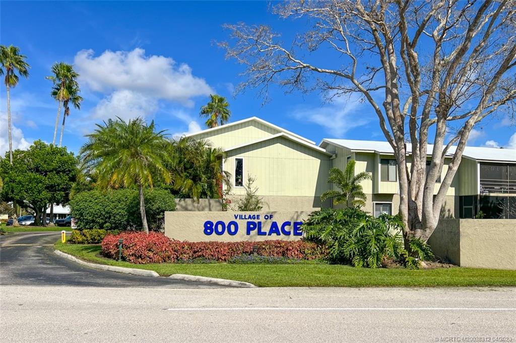 800 Northwest Fork Road, Unit 86 Stuart, FL 34994 - Photo 34 of 40 a front view of a house with a garden