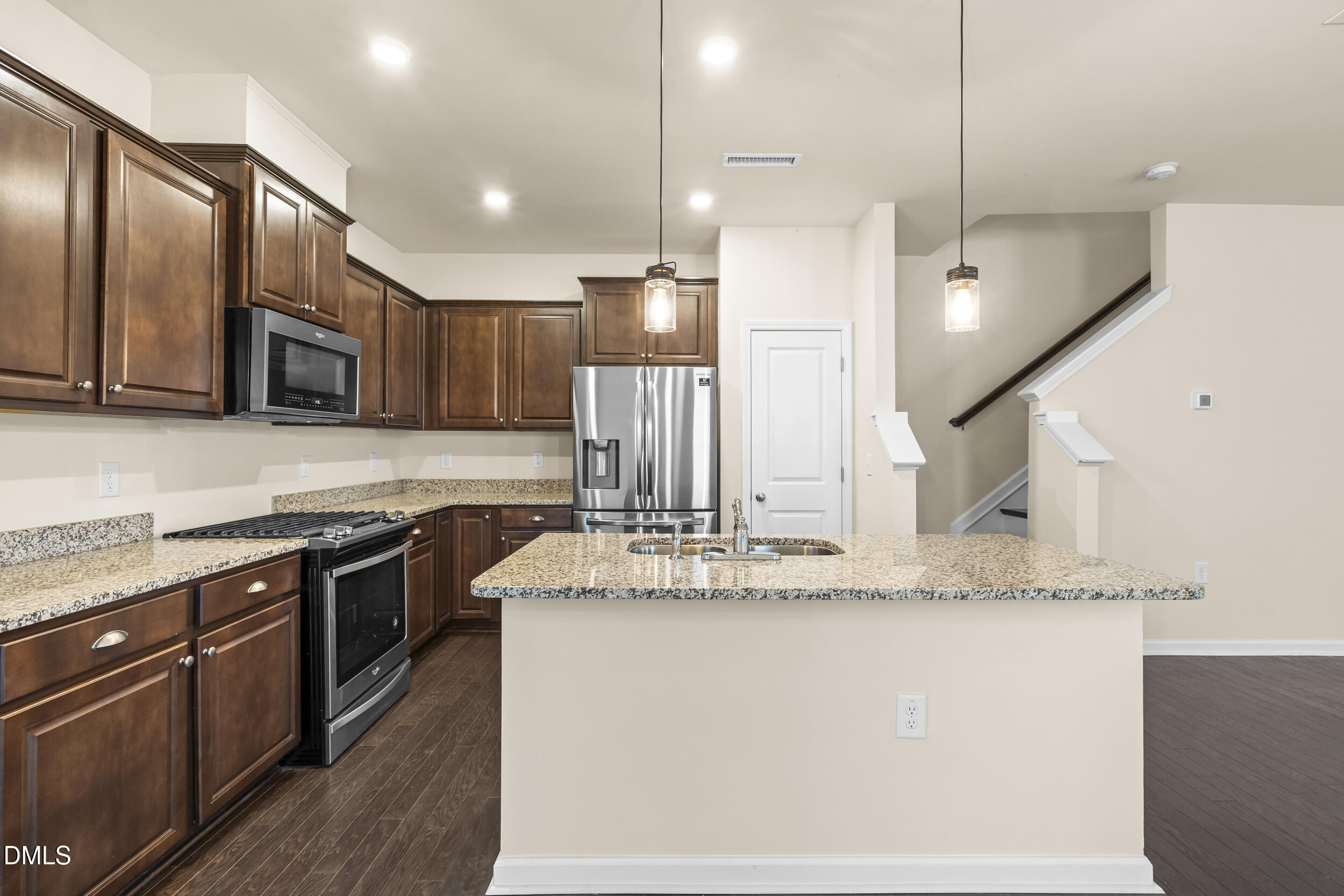 113 Lafferty Street Durham, NC 27703 - Photo 13 of 39 a kitchen with stainless steel appliances granite countertop a sink a stove and a refrigerator