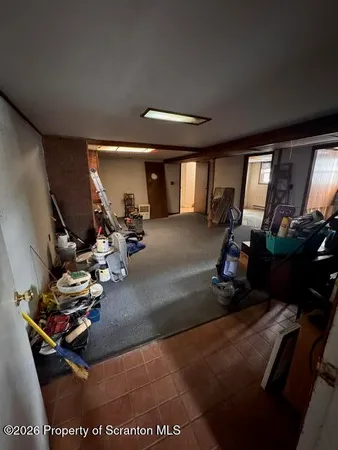 a room with gym equipment and a large window
