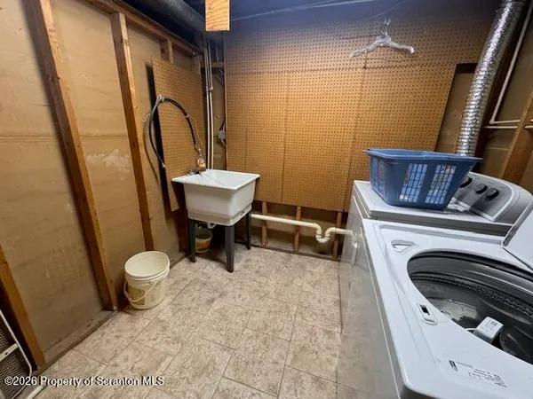 a bathroom with a toilet a sink and a mirror