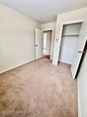 an empty room with a bathroom