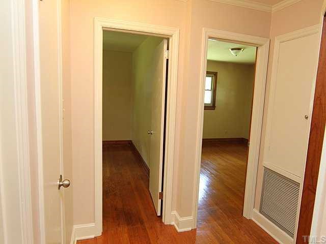 611 Crosby Road Durham, NC 27704 - Photo 12 of 25 Convenient linen closets on both left and right sides of hallway in BR/BA wing of house.
