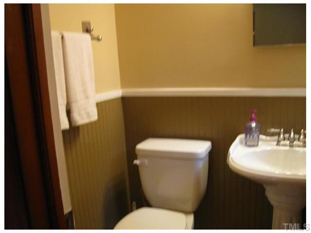 611 Crosby Road Durham, NC 27704 - Photo 14 of 25 Newly remodeled 1/2 Bath off MBR has pedestal sink, brushed nickel faucet, light fixture, and hardware. Note beadboard walls with chair rail molding. Mirrored Medicine Cabinet over sink. New ceramic tile floors laid in diagonal pattern.