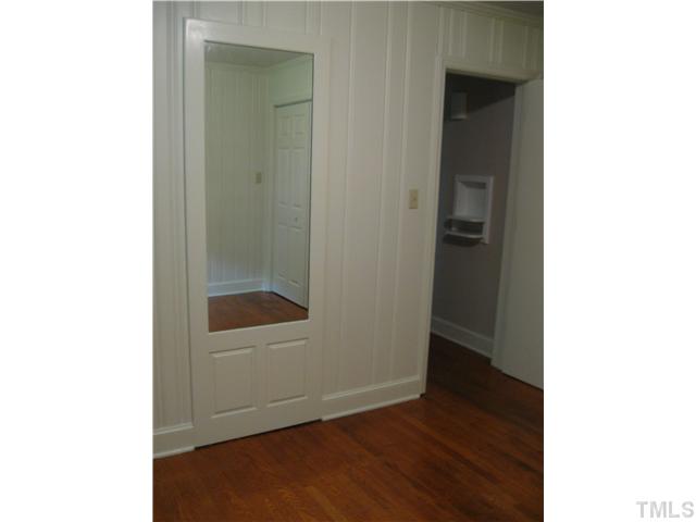 611 Crosby Road Durham, NC 27704 - Photo 16 of 25 Note the 2 unique features seen in and from BR3. The mirrored panel is built into the wall and the telephone niche in the hallway is reminiscent of days gone by.