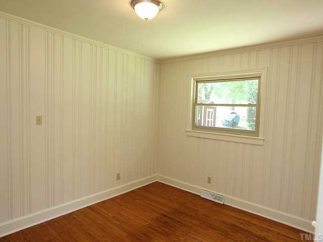 611 Crosby Road Durham, NC 27704 - Photo 17 of 25 Pine tongue & groove paneling and trim were meticulously prepped and painted for a very finished look. Large window in BR3 overlooks spacious back yard.
