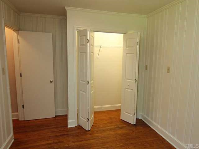 611 Crosby Road Durham, NC 27704 - Photo 18 of 25 BR3 has had a major remodel. Previously a functionally obsolete walk-thru room from the Kitchen w/tongue & groove pine paneling, carpet, and no closet, now it is truly a 3rd Bedroom w/newly built closet w/light, painted walls, and newly exposed HW floors.