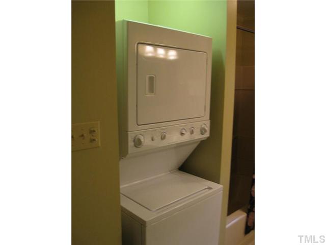 611 Crosby Road Durham, NC 27704 - Photo 20 of 25 Stacked Washer/Dryer combo has barely been used and conveys with house. Nice lighting in W/D alcove and closet across from unit is full size for storage of all bath and laundry products.