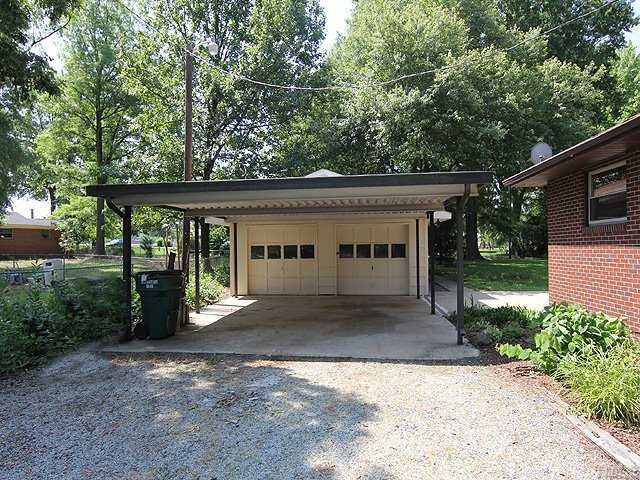 611 Crosby Road Durham, NC 27704 - Photo 22 of 25 Wide Driveway and Parking Pad under 2-car Carport will accomodate several vehicles.