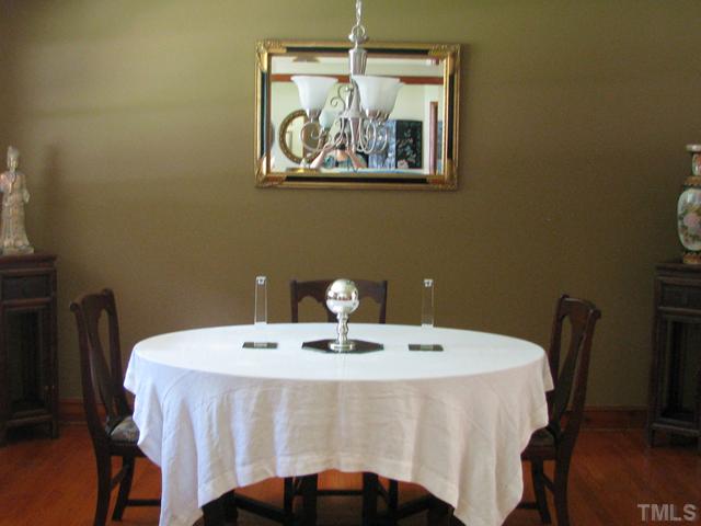 611 Crosby Road Durham, NC 27704 - Photo 7 of 25 ALL Oak Hardwoods covered for decades by carpeting have been refreshed. Fresh paint and Brushed Nickel Light Fixture add to Dining Room charm.
