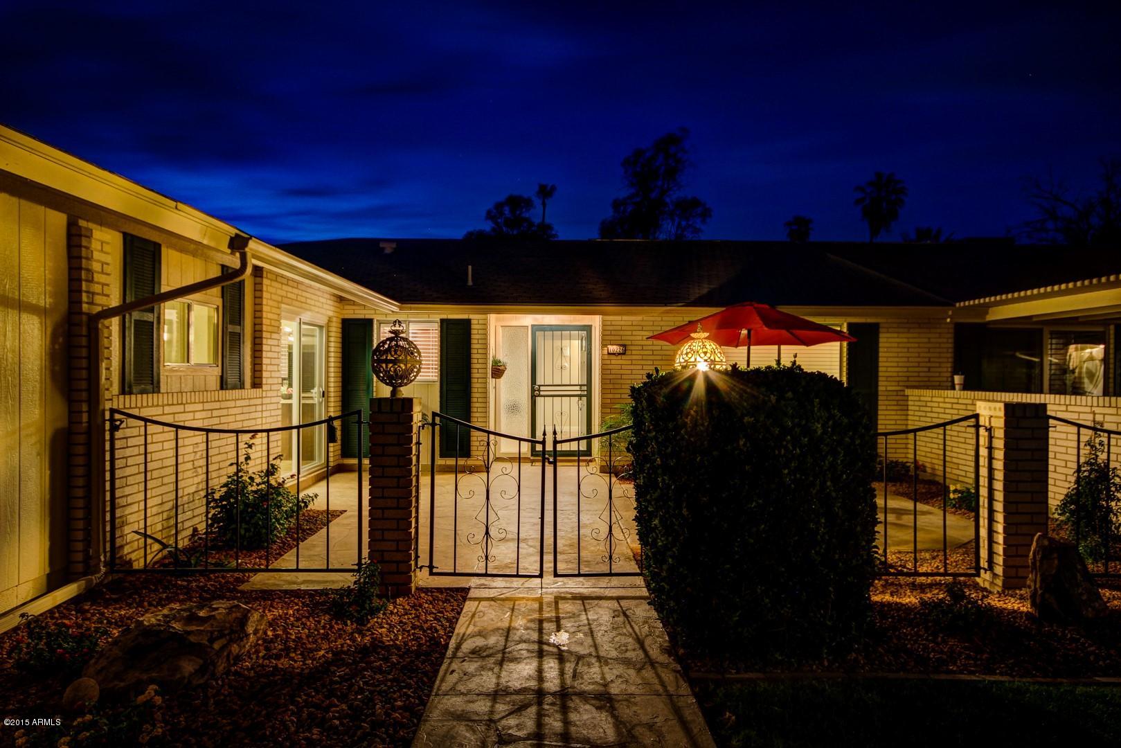 10226 West Mountain View Road Sun City, AZ 85351 - Photo 56 of 58 Courtyard at night