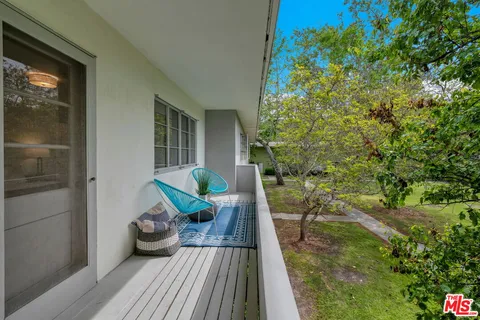 a view of balcony with furniture