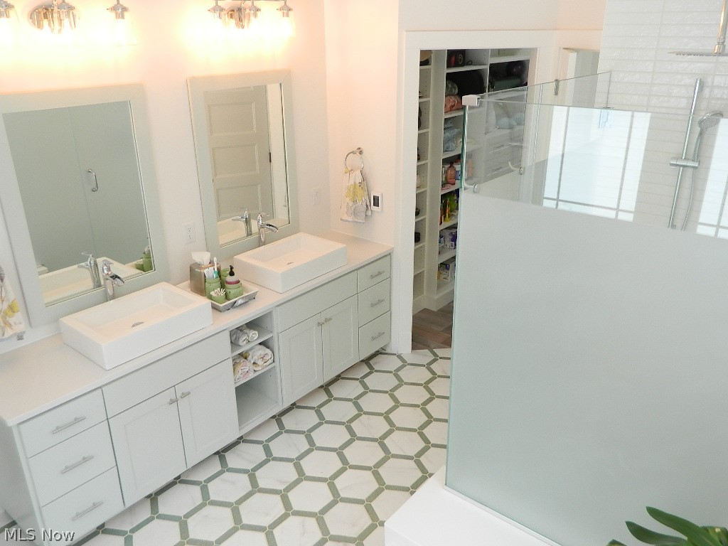 12464 Hotchkiss Road Burton, OH 44021 - Photo 13 of 35 Gorgeous Ceramic Master Bathroom with Jetted Tub, Two Sinks, Private Oversized Rain Shower, Separate Room for Commode and a Newly Enhanced Walk In Closet with Custom Organization!!!