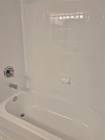 a close up of a bathtub in a bathroom