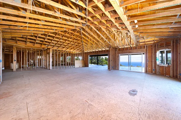 a view of a big room with closet and windows