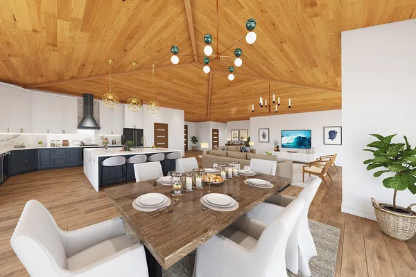a open dining room with furniture a chandelier and kitchen view
