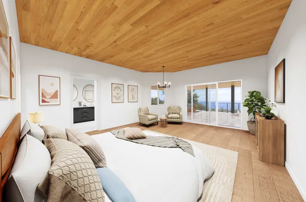 a bedroom with a large bed and wooden floor
