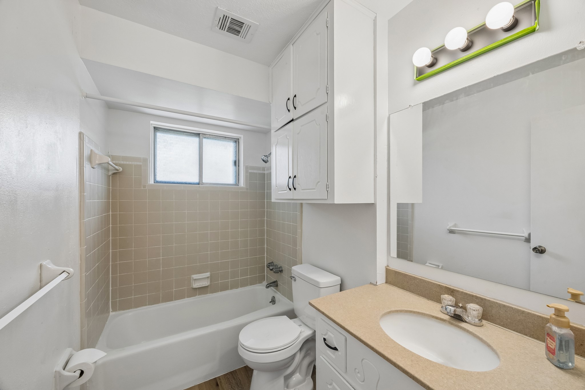 4903 Mistletoe Road Pasadena, TX 77505 - Photo 9 of 10 a bathroom with a granite countertop sink toilet tub and shower