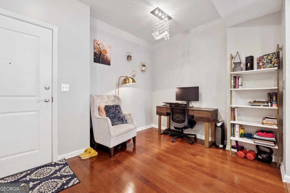 3040 Peachtree Road Northwest, Unit 702 Atlanta, GA 30305 - Photo 13 of 26 a view of a workspace with furniture and a window