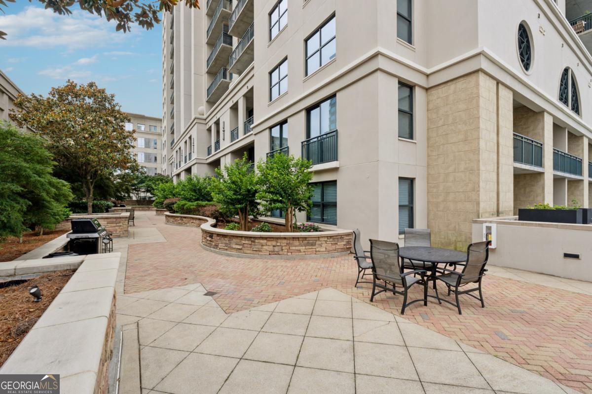 3040 Peachtree Road Northwest, Unit 702 Atlanta, GA 30305 - Photo 3 of 26 a view of a building with sitting area