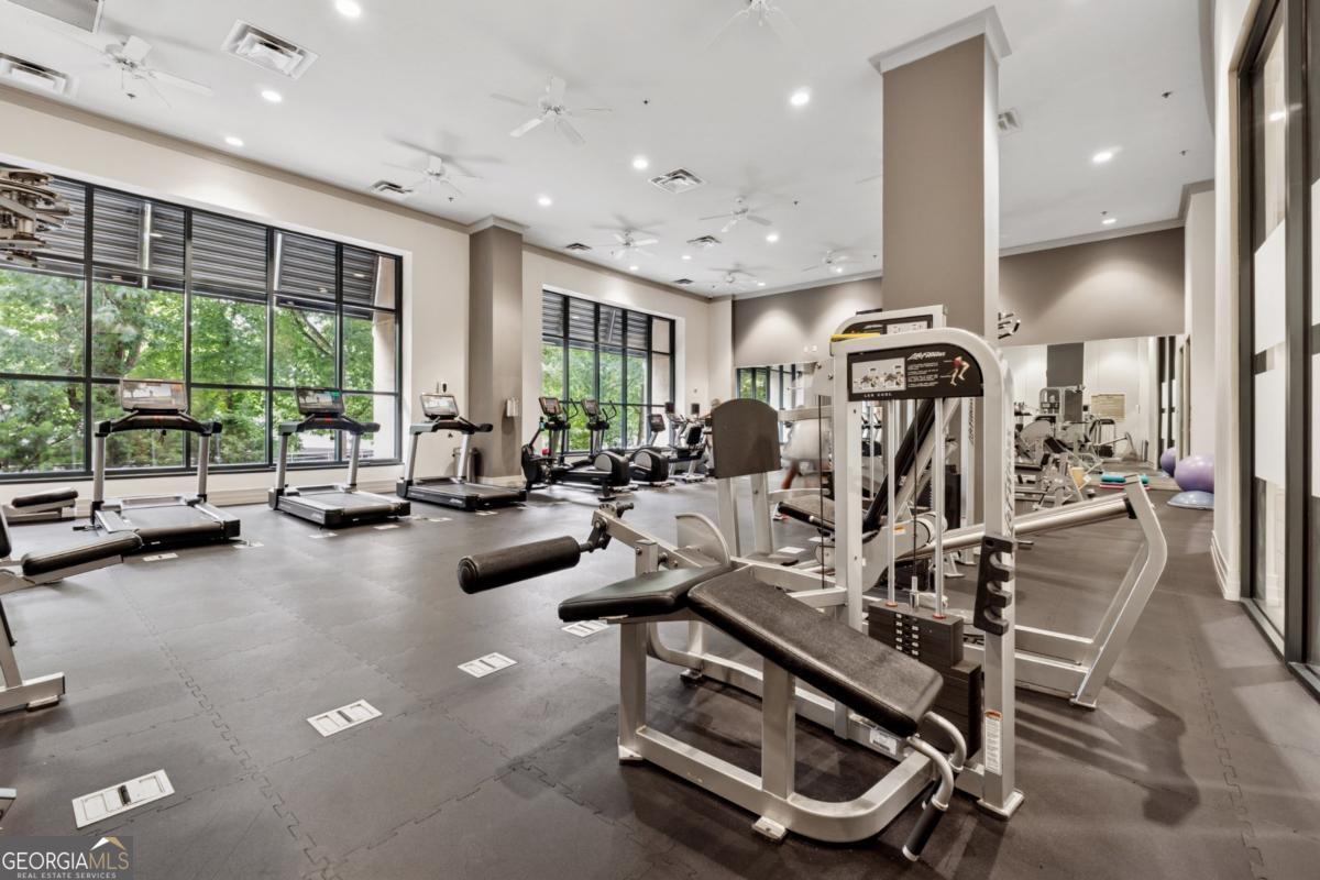 3040 Peachtree Road Northwest, Unit 702 Atlanta, GA 30305 - Photo 7 of 26 a view of a room with gym equipment