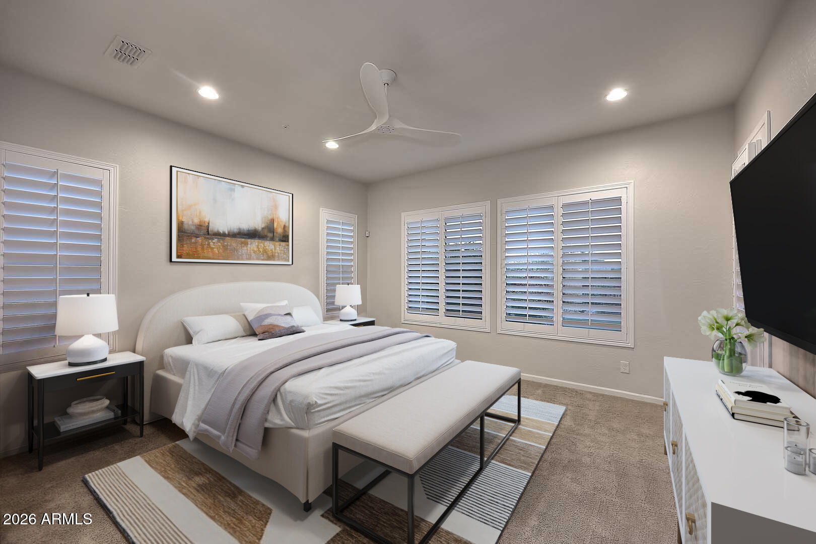 17916 East Cindercone Road Rio Verde, AZ 85263 - Photo 18 of 80 a bedroom with a bed a couch and a flat screen tv