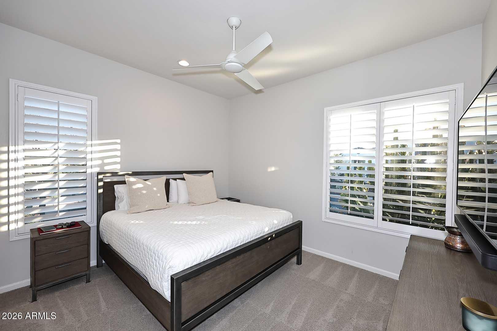 17916 East Cindercone Road Rio Verde, AZ 85263 - Photo 53 of 80 a large bed sitting in a bedroom next to a window