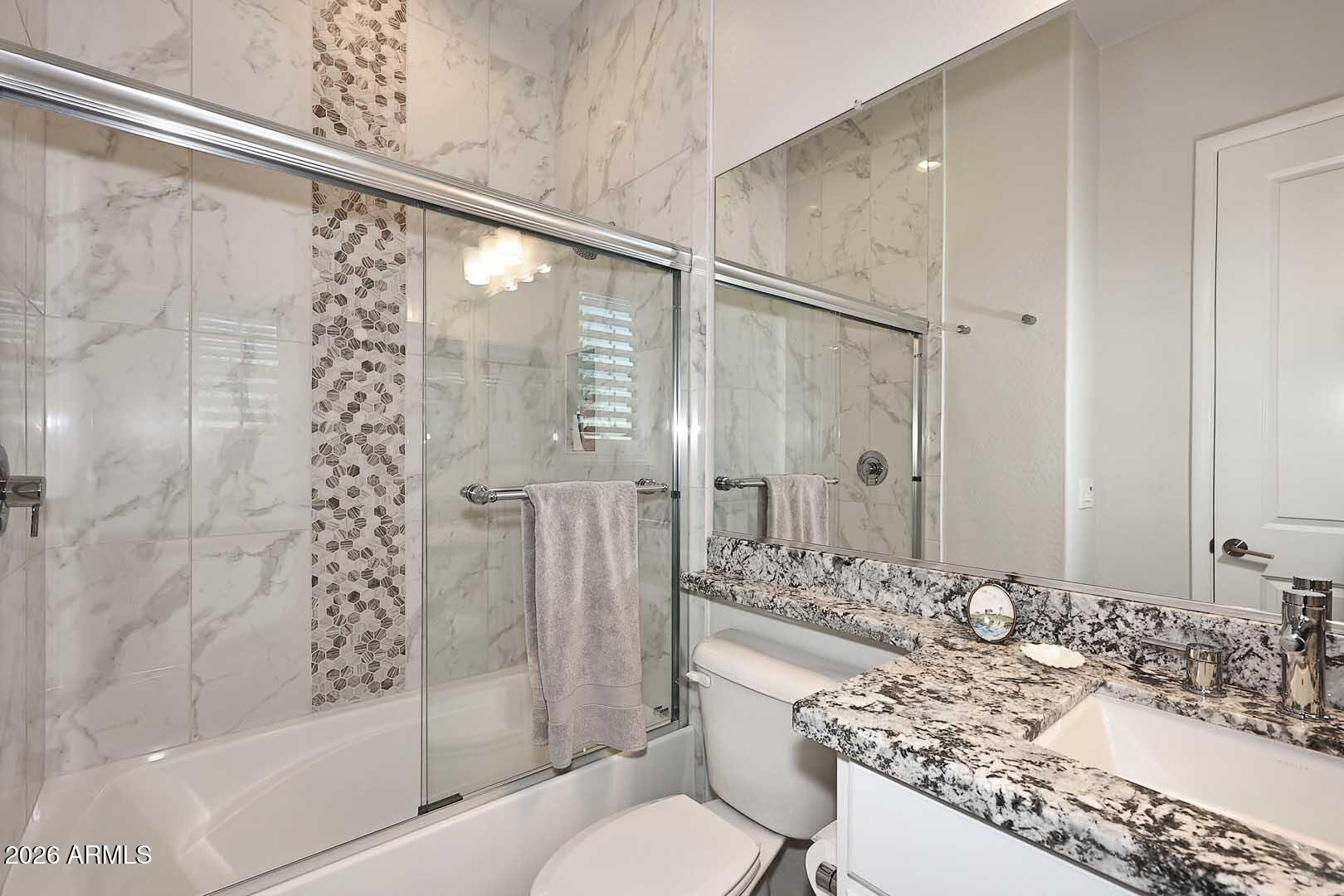 17916 East Cindercone Road Rio Verde, AZ 85263 - Photo 56 of 80 a bathroom with a granite countertop tub sink vanity and toilet