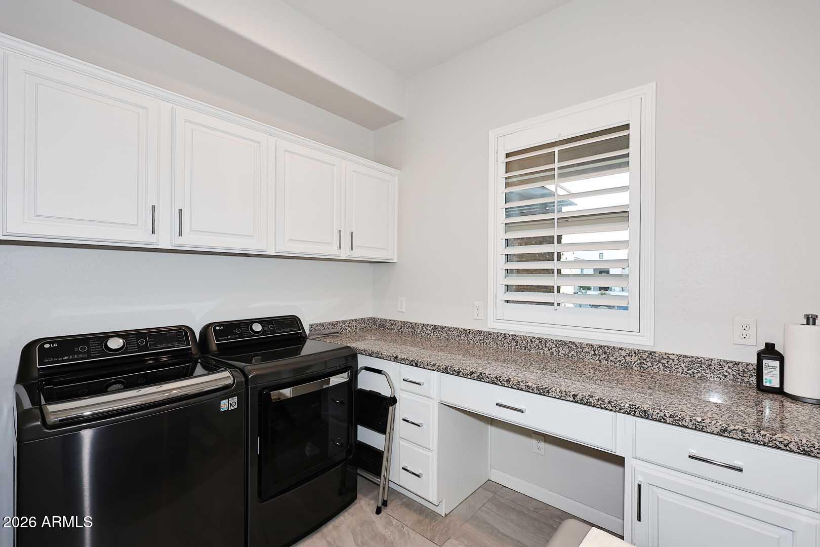 17916 East Cindercone Road Rio Verde, AZ 85263 - Photo 58 of 80 a kitchen with granite countertop a sink stove and cabinets