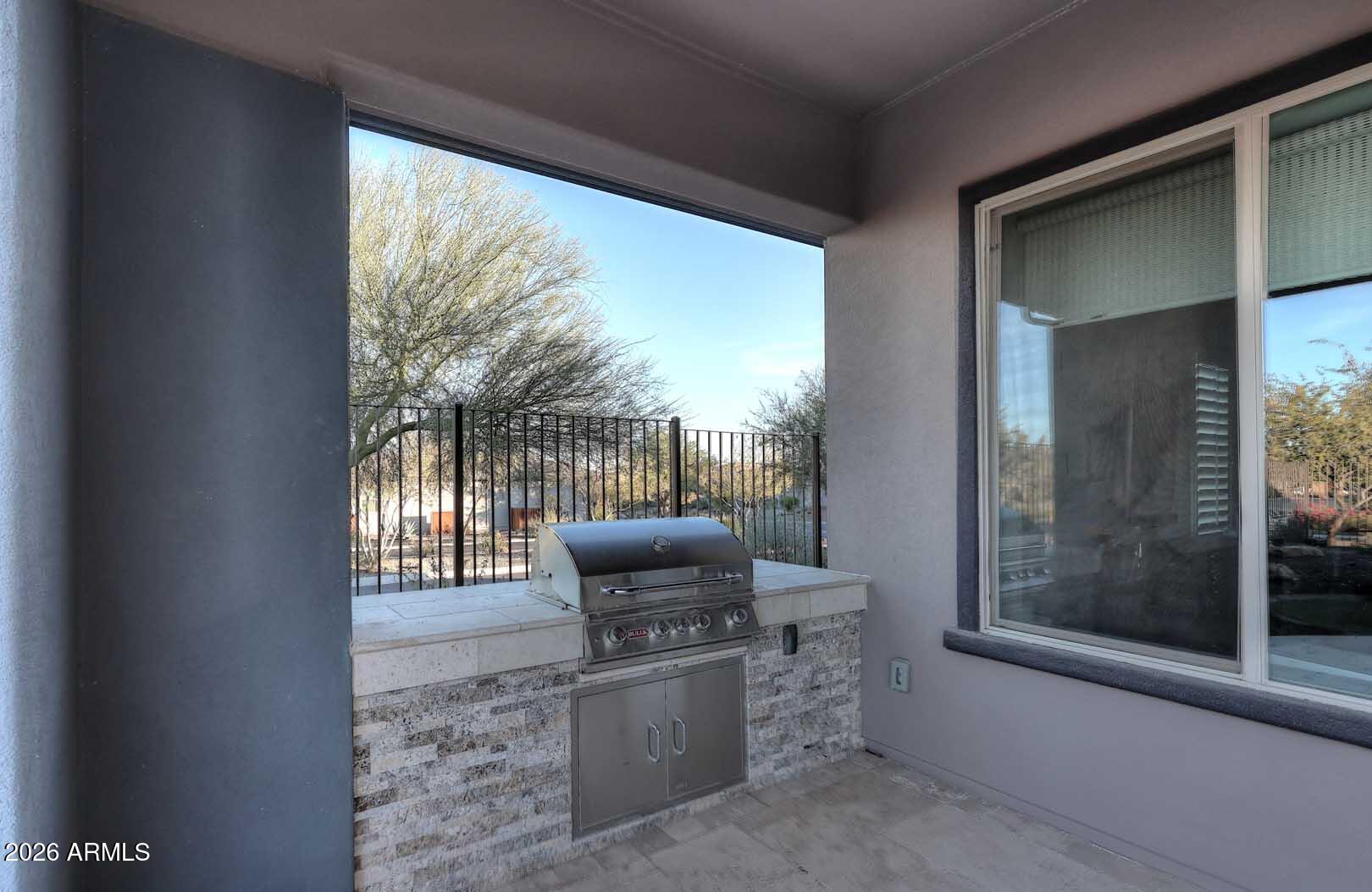17916 East Cindercone Road Rio Verde, AZ 85263 - Photo 59 of 80 a living room with furniture and a floor to ceiling window