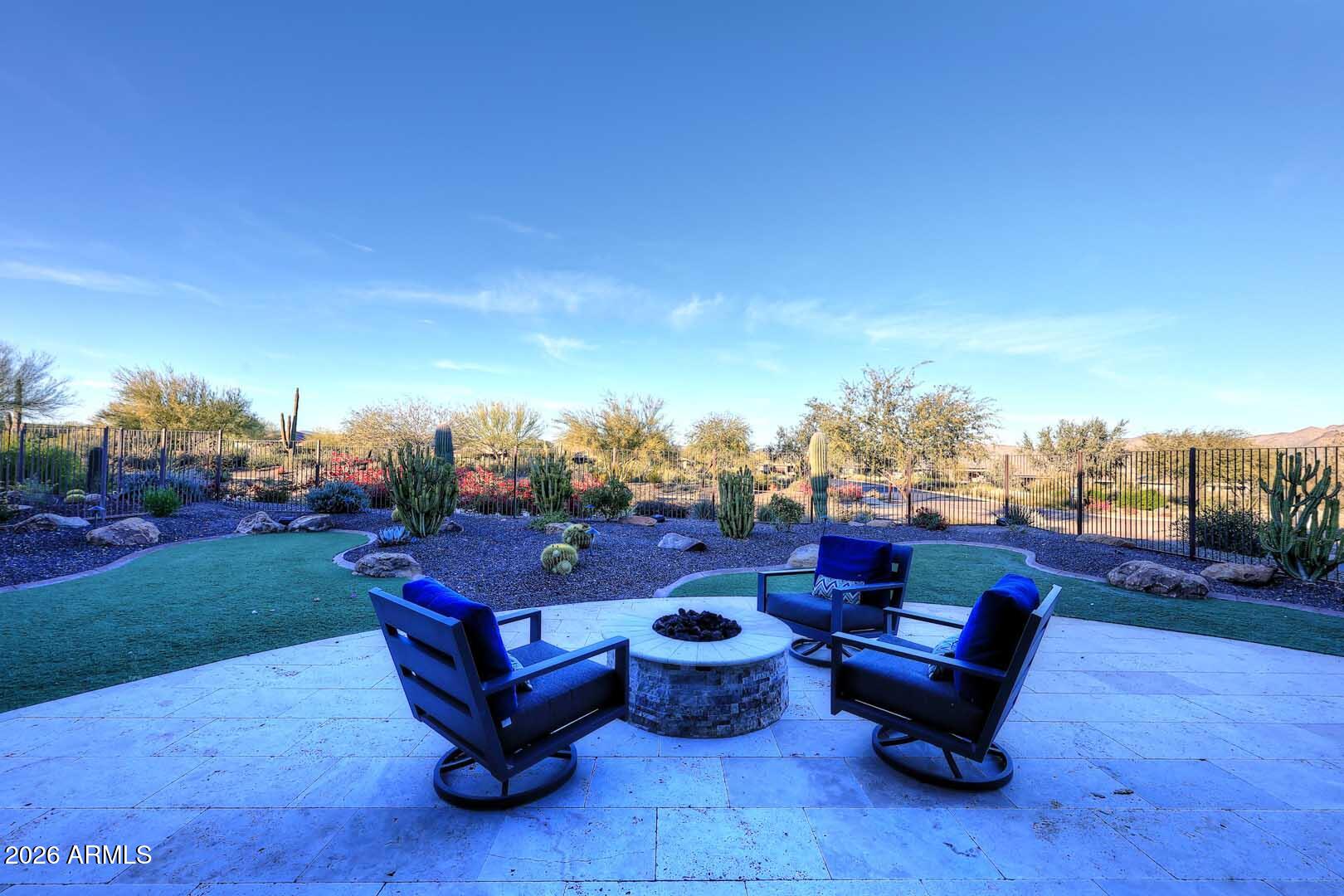 17916 East Cindercone Road Rio Verde, AZ 85263 - Photo 63 of 80 a view of a chairs and tables in the backyard