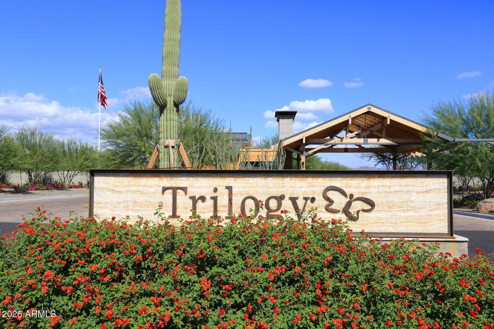 17916 East Cindercone Road Rio Verde, AZ 85263 - Photo 70 of 80 a sign that is sitting in front of flowers