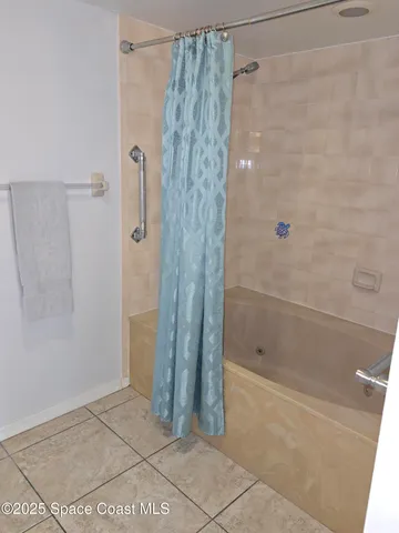 a bathroom with a shower and a tub