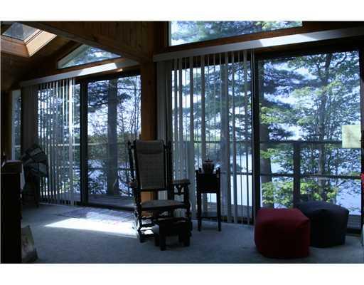 208 Georges Pond Road Franklin, ME 04634 - Photo 5 of 11 Patio/Deck. Sun porch overlooking pond