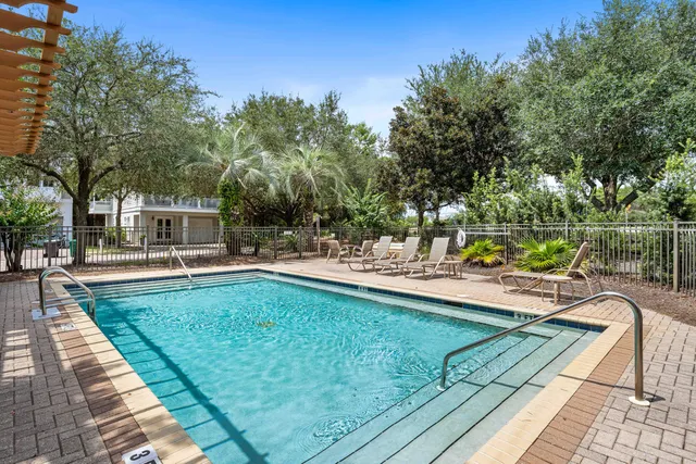 a view of a swimming pool with a patio