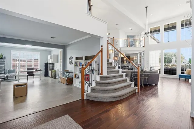 a view of entryway and hall with wooden floor