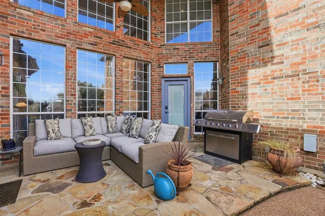 a view of a patio with couches table and chairs