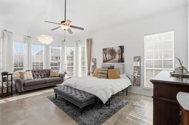 a bedroom with a bed and a couch