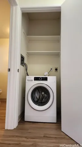 a utility room with washing machine
