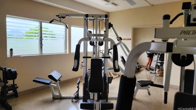 a view of gym equipment and windows