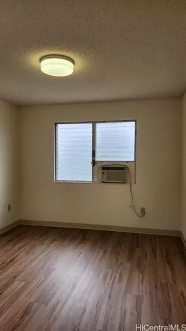 an empty room with wooden floor