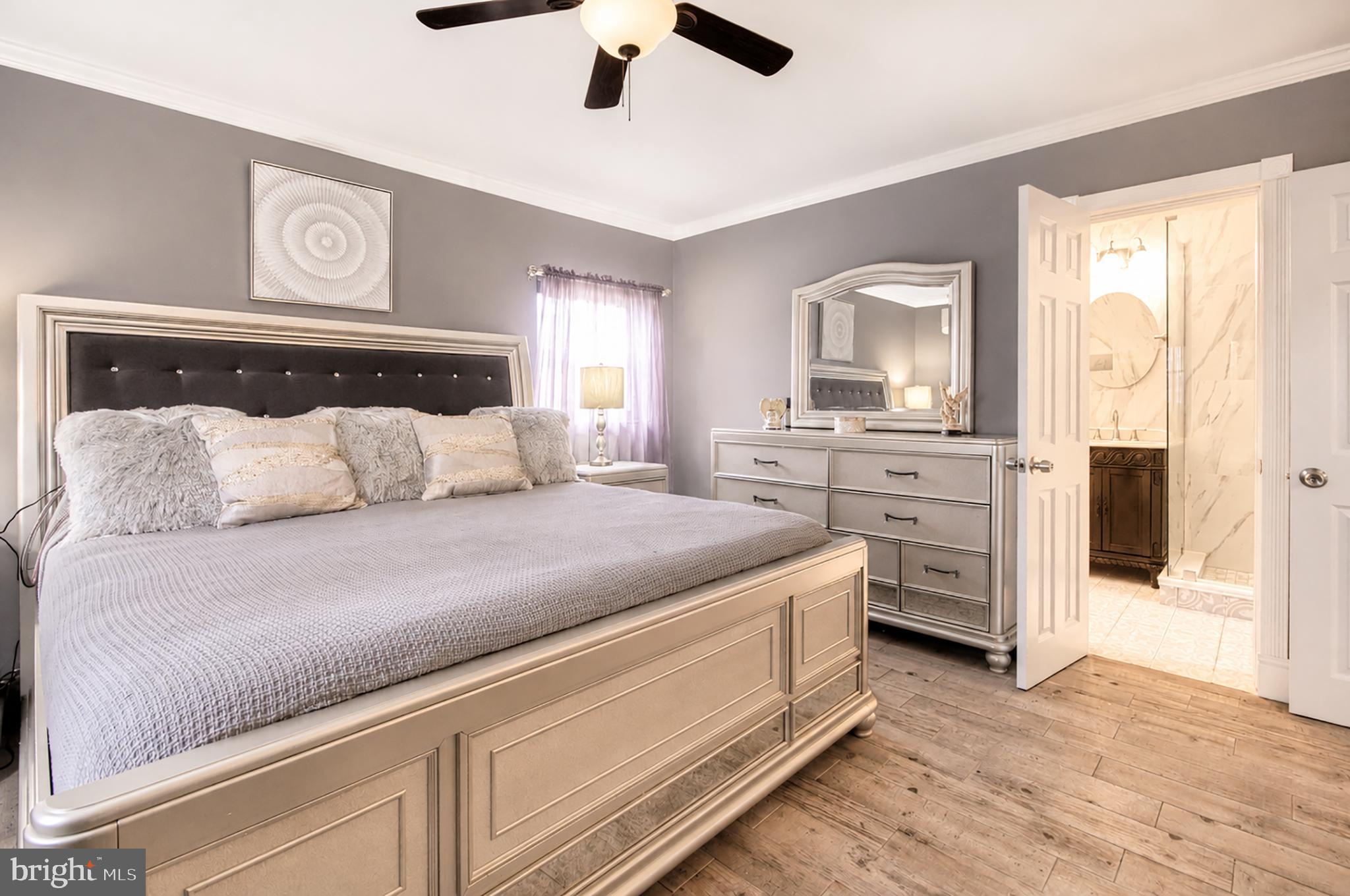32 Bryant Road Turnersville, NJ 08012 - Photo 14 of 33 a spacious bedroom with a bed and a dresser
