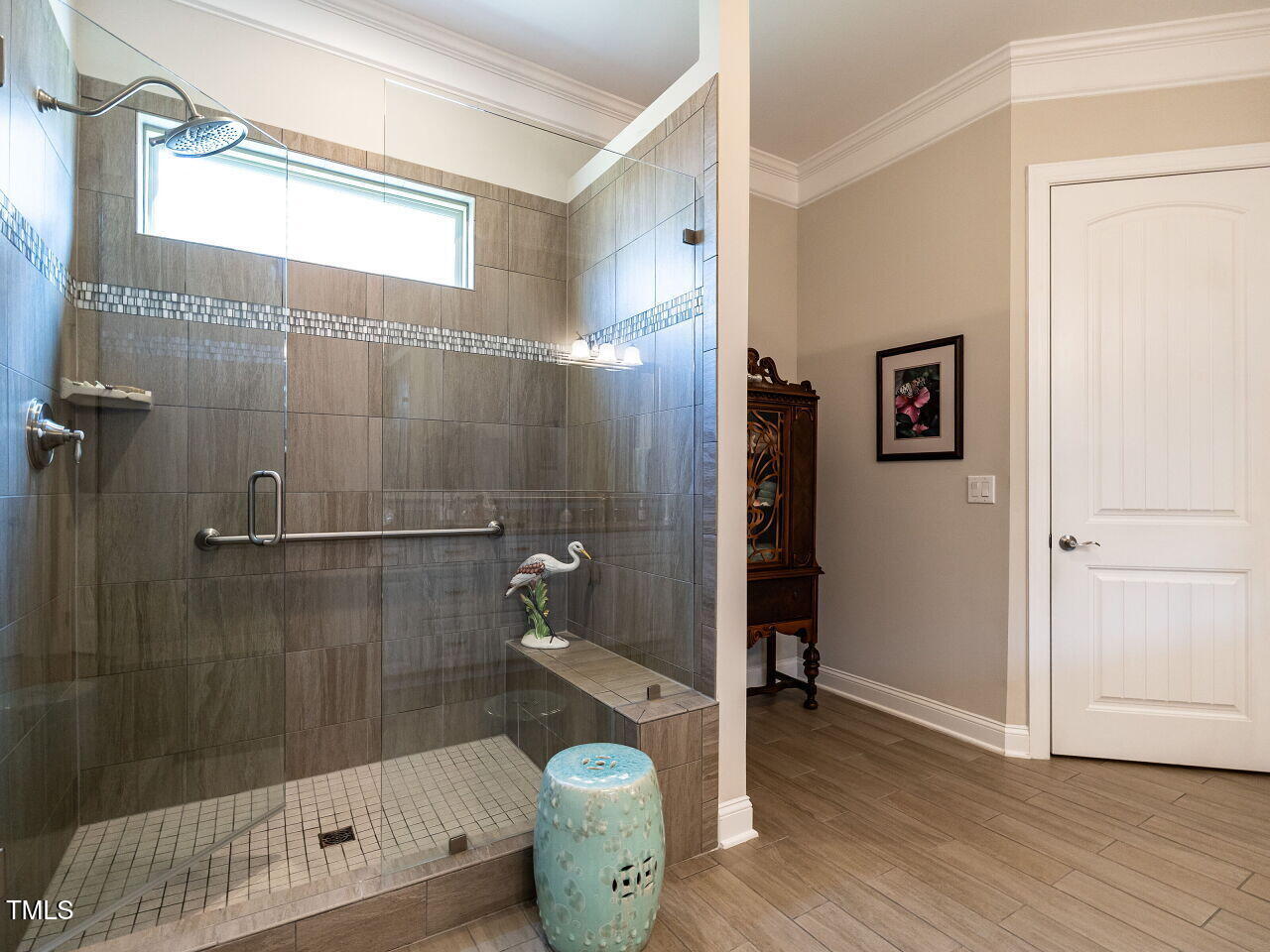 8461 Lentic Court Raleigh, NC 27615 - Photo 20 of 37 Oversized shower with Transom window for privacy and natural light.