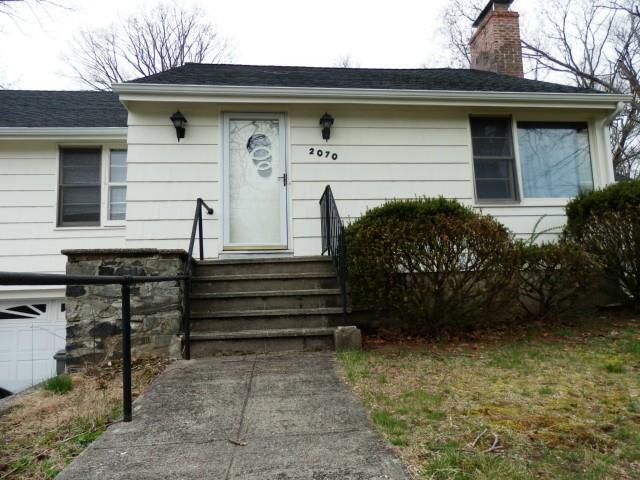 2070 Old Town Road Trumbull, CT 06611 - Photo 1 of 1 a front view of a house with a garden